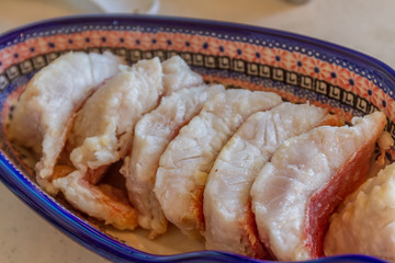slightly fried fish slices ready for cooking
