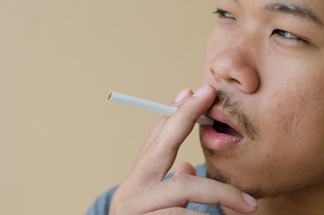 young man smoking a cigarette