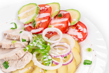 Warm meat salad with vegetables.