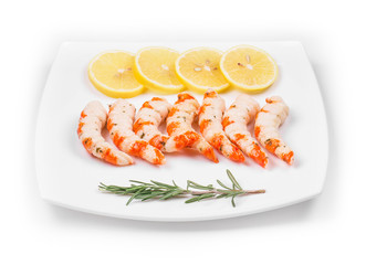 Cooked unshelled shrimps with lemon.