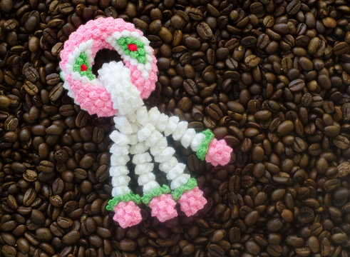 garland knitting on coffee bean background