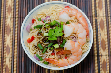 bowl of noodles with vegetables and prawn