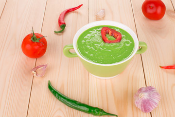 Broccoli cream soup on table.