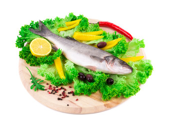 Fresh seabass on platter with lettuce.