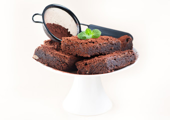 Chocolate cake brownies on light background