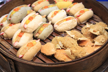 Stream pork buns and pork crab in bamboo steamer