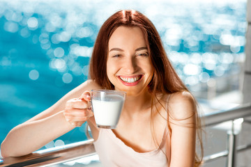 Young and pretty woman on the balcony