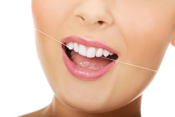 Woman with dental floss.