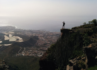 Woman on a edge of a mountain. Tenerife, Spain