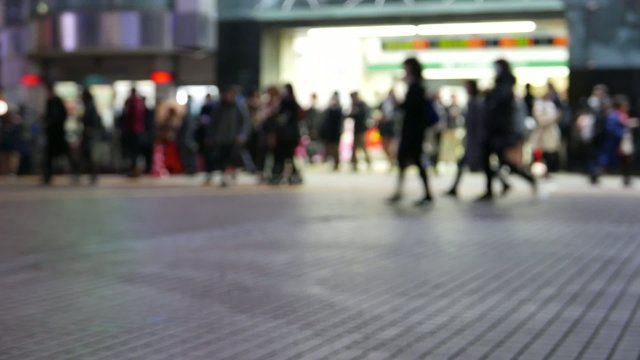 Anonymous crowd of people walking in Shibuya Tokyo, Japan.