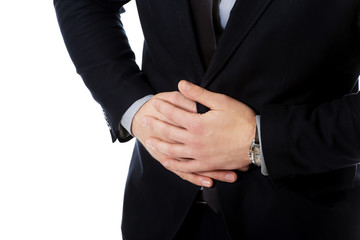 Obraz premium Businessman suffering from stomach pain.