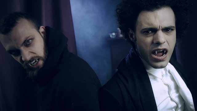 Two angry hungry vampires looking at each other