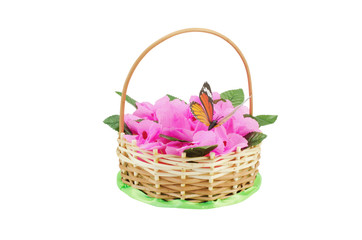 Fototapeta na wymiar Beautiful wattled basket with artificial flowers