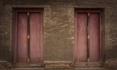 Old brick wall and old wooden door.