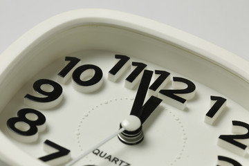 Obraz na płótnie Canvas White alarm clock on a white background