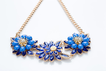 plastic necklace. three blue flower