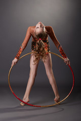 Cute little gymnast performs with hula hoop © Wisky
