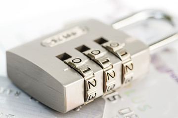Close up of credit cards with padlock. Credit card security conc