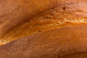 Fragment of long loaf white bread