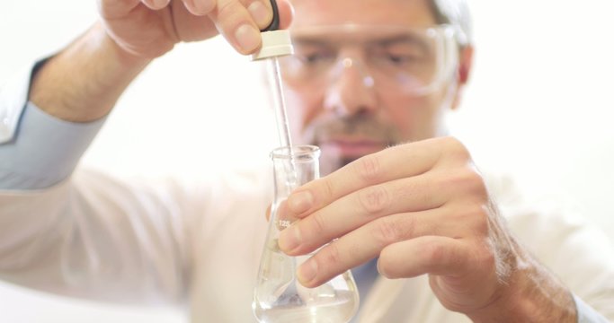 A scientist in a lab testing water hardness