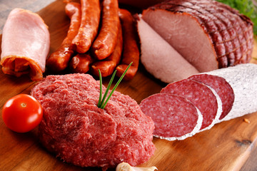 Assorted meat products including ham and sausages
