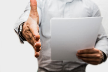 man in shirt stretching his arm to handshake