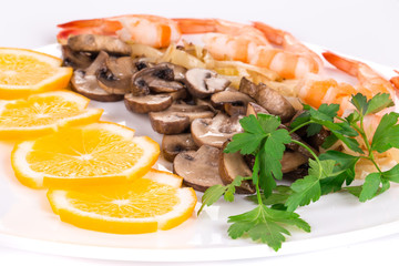 Shrimp salad with mushrooms close up.