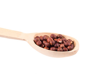 Wooden spoon with nuts.