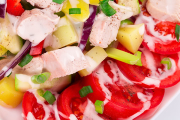 Warm meat salad with vegetables.