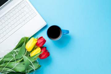 Cup of coffee and tulips