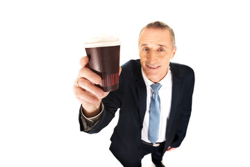 Smiling businessman with a cup of coffee