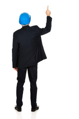 Businessman engineer pointing up