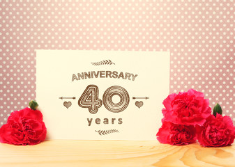 Obraz na płótnie Canvas 40 years anniversary card with pink carnations