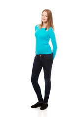 Fototapeta premium Young woman standing with toothy smile