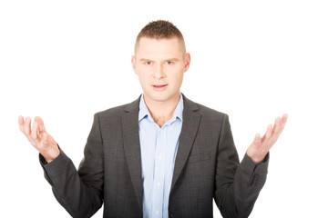 Angry businessman with open hands