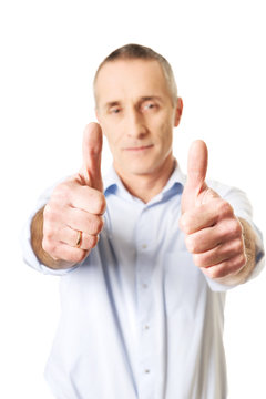 Mature man gesturing ok sign