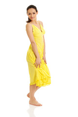 Beautiful female model in yellow dress.