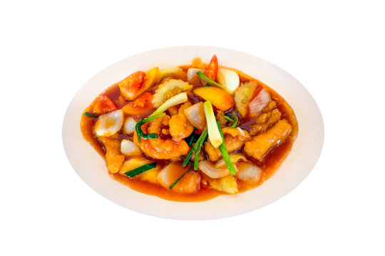 fried grouper fish spicy sweet and sour sauce on isolated backgr
