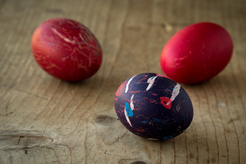 colored eggs on wooden table