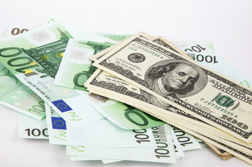 money, euro and dollars on a white background