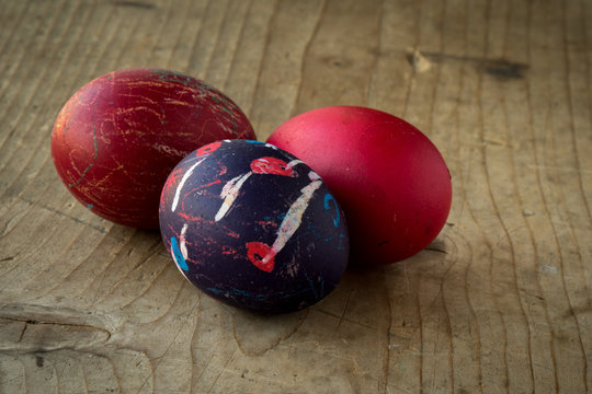 colored eggs on wooden table