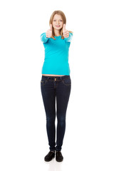 Fototapeta premium Woman showing thumbs up with both hands