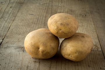 potatoes on wooden table