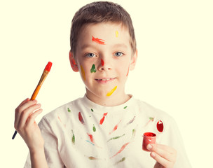 Child with paintbrush