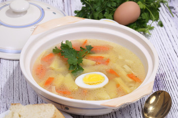 Chicken soup with noodles and egg