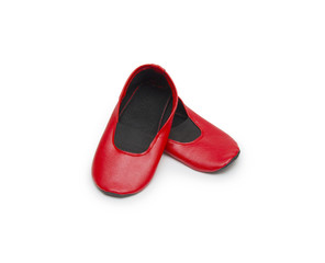 Childrens gym shoes isolated against a white background