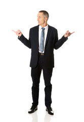 Businessman with hands on both sides