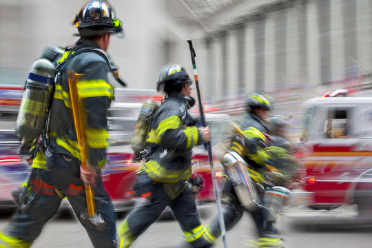 fire trucks and firefighters brigade in the city