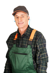 Mature worker wearing ear protectors