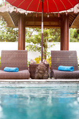 Beach chairs near swimming pool